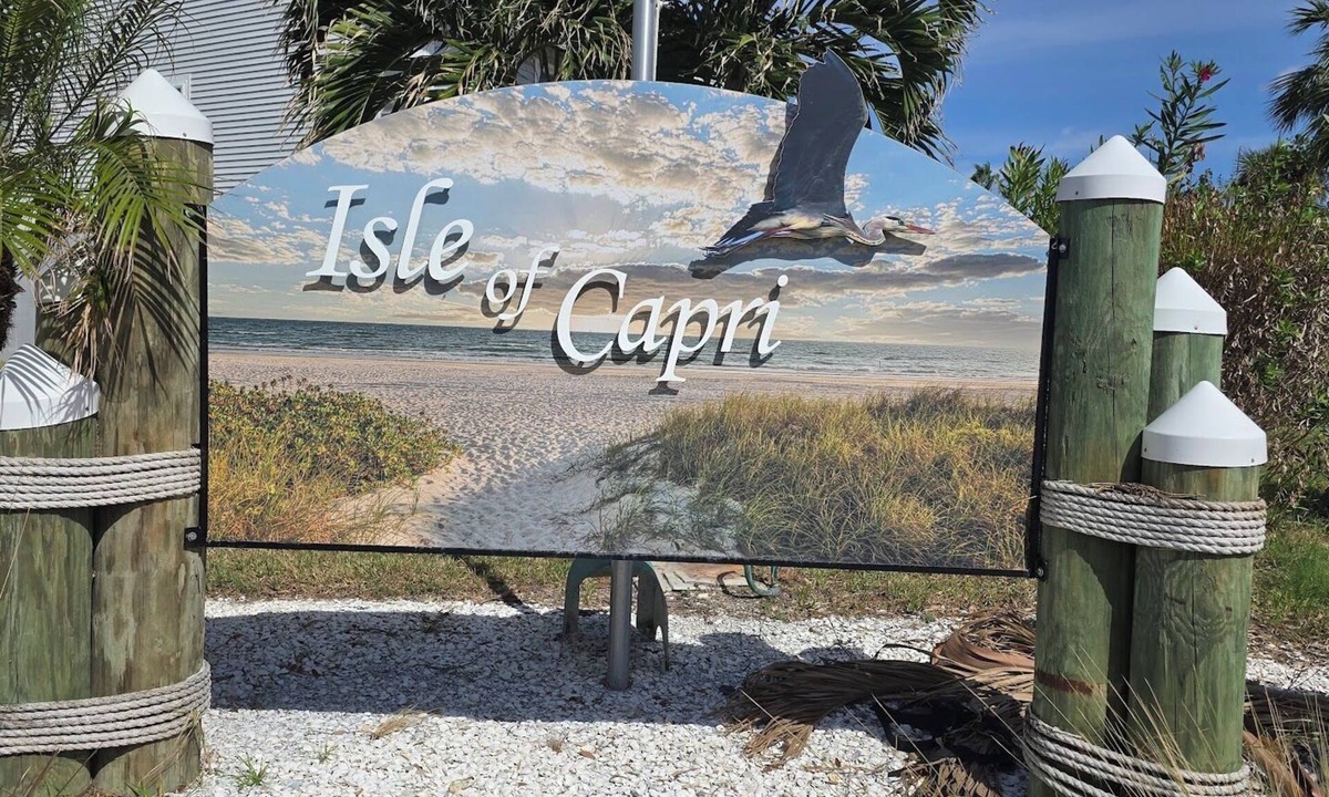 Capri Isle House | Charming 2 Bed Treasure Island Townhouse, heated community pool.