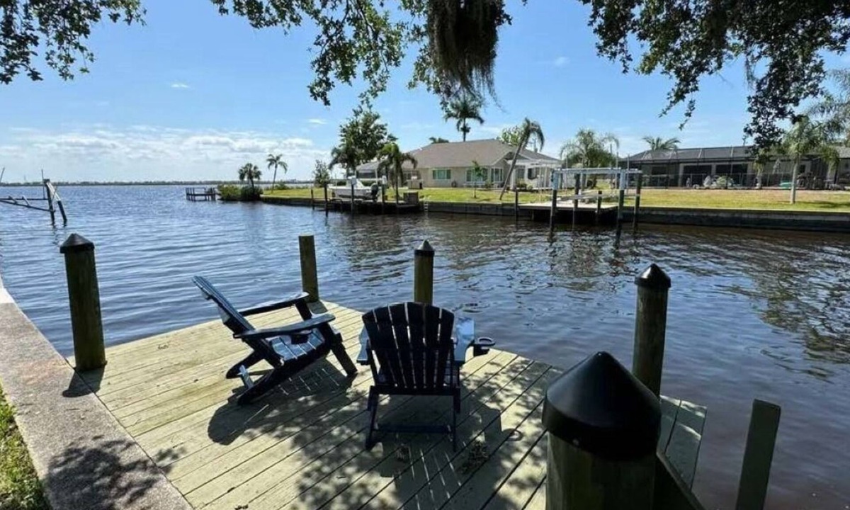 Gulf Cove House | Cozy and private waterfront retreat with hot tub, grill, deck, and firepit!