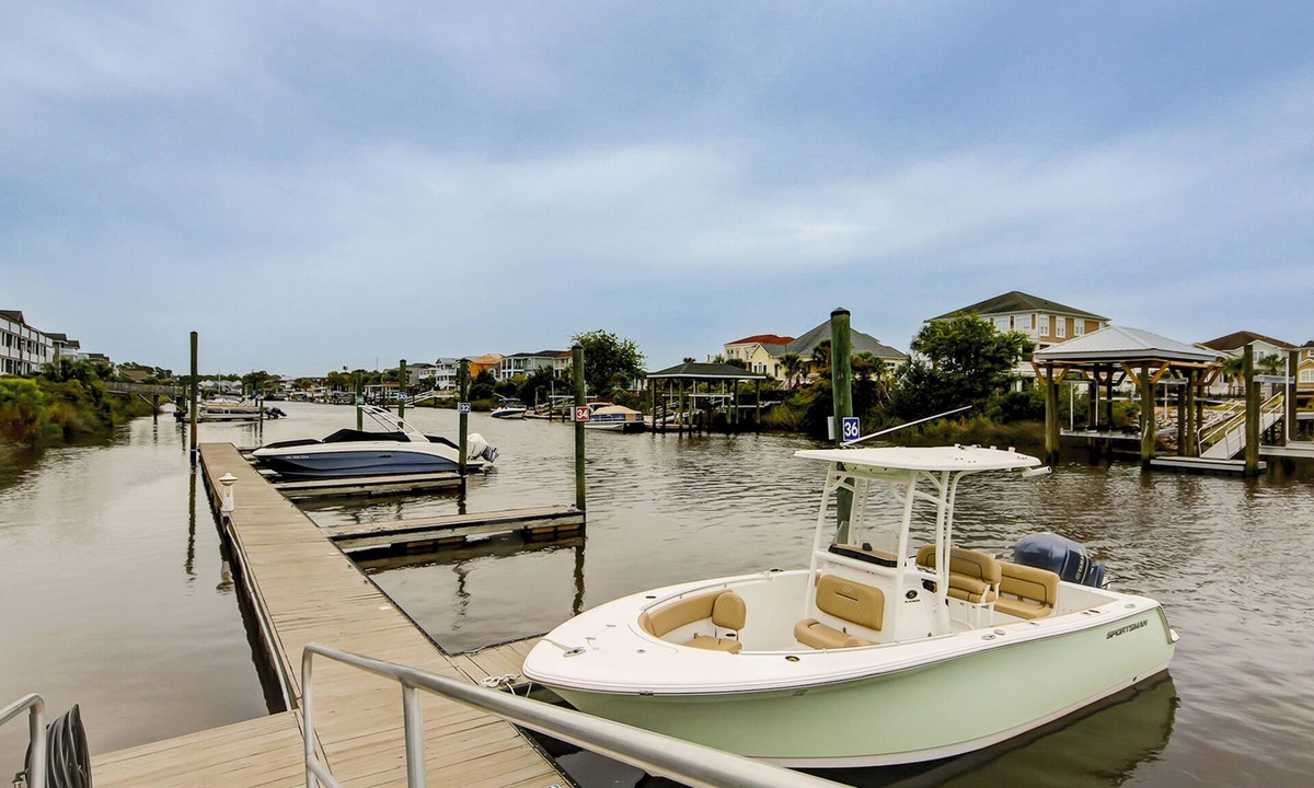 Carolina Yacht Landing Condo | Lakefront condo with private balcony, pool, close to beach