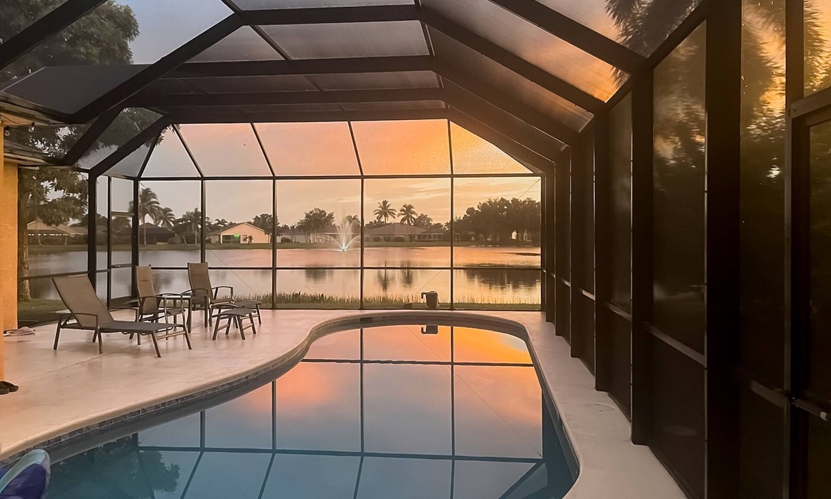 Beachwalk Isles House | Lakefront one-level home with pool, screened lanai & W/D - snowbird-friendly