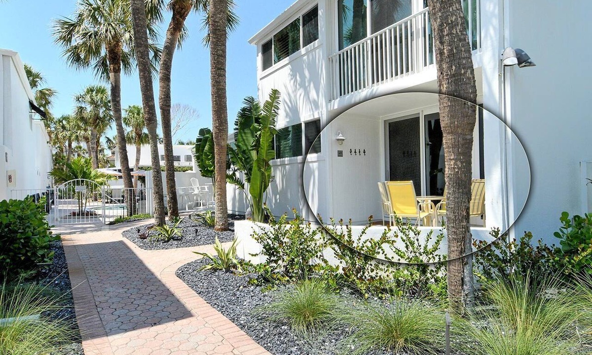 Longboat Key Apartment | LaPlaya 101E-Relax on your private lanai under the palms!