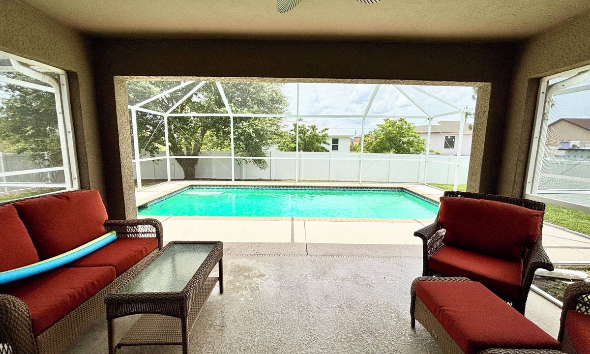 Harris House | Salt water, screened-in heated pool house and lanai