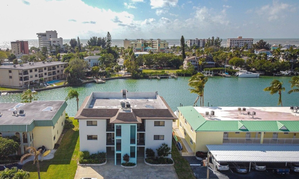 Capri Isle Condo | Treasure Island escape. Dolphins, manatees & beach