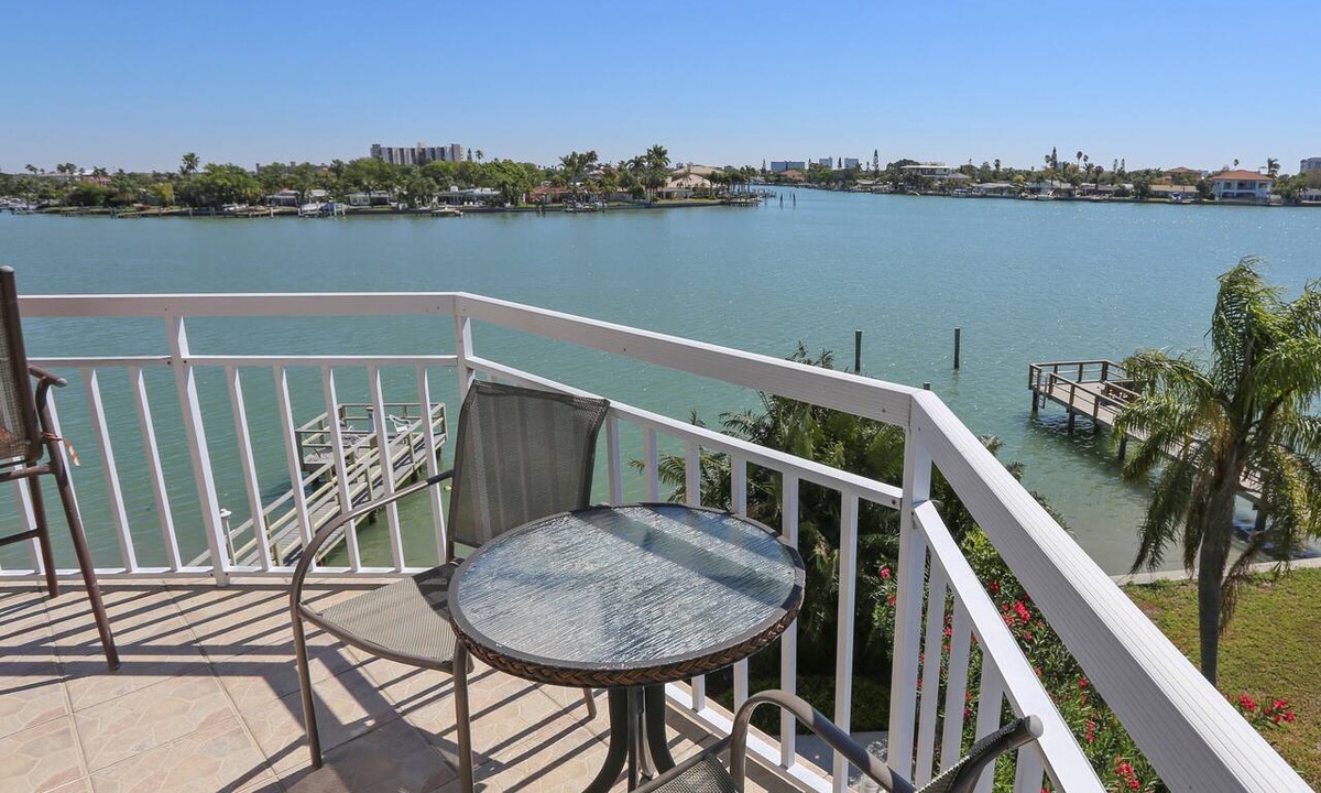 Treasure Island Condo | Water Views - Walk to Beach and Restaurants - Waterfront Pool - Low Density