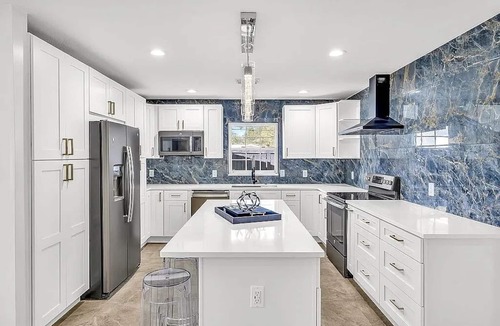 Port Tampa City House | 4 Bedroom near MacDill with a full sunroom, deck and yard