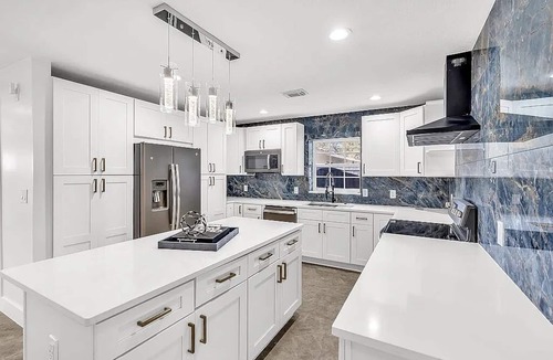 Port Tampa City House | 4 Bedroom near MacDill with a full sunroom, deck and yard