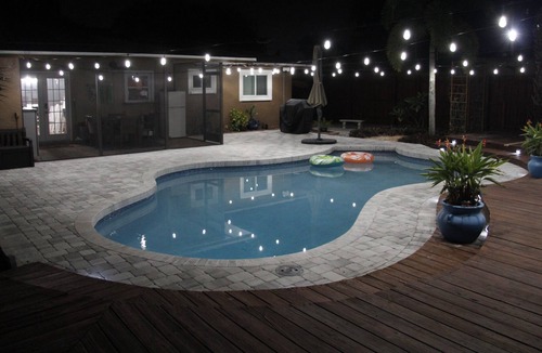 Crooked Creek House | Amazing home with heated pool, tiki bar and luscious outdoor close to beaches