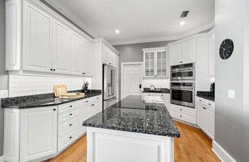 Ballast Point House | Bayshore Breeze! Private gated waterfront home in south Tampa.
