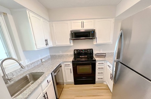 Caswell Beach Condo | BEACHFRONT:3 BR, 2 Full BA, Renovated, Beach Access , BBQ, Pool, Sleeps 9