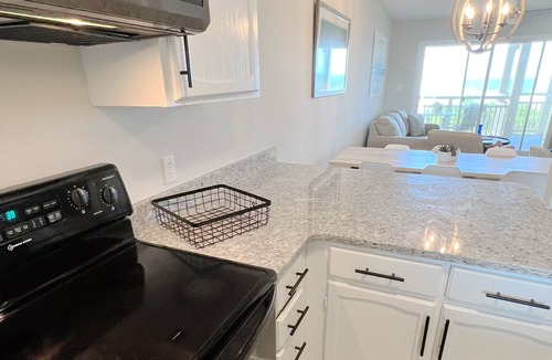 Caswell Beach Condo | BEACHFRONT:3 BR, 2 Full BA, Renovated, Beach Access , BBQ, Pool, Sleeps 9
