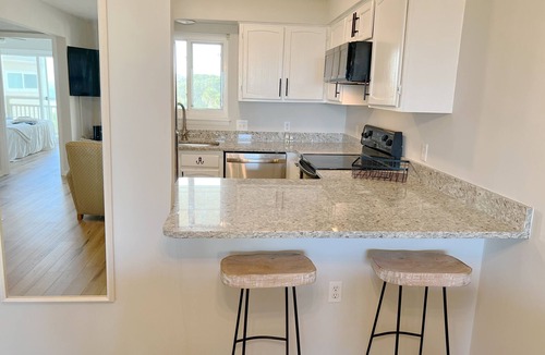 Caswell Beach Condo | BEACHFRONT:3 BR, 2 Full BA, Renovated, Beach Access , BBQ, Pool, Sleeps 9