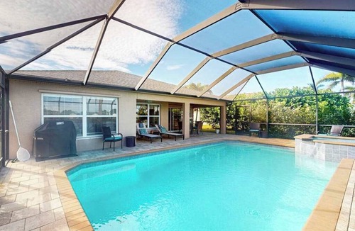 Beachwalk Isles House | Beautiful Lakefront Home with Private Pool/Spa, Furnished Lanai, Grill, & WiFi