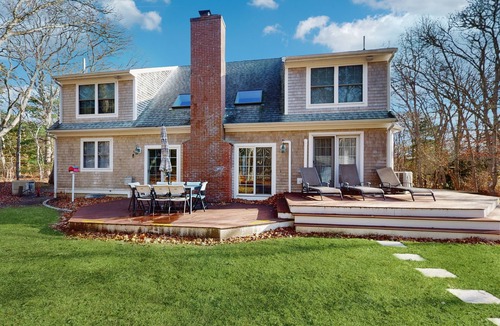 West Falmouth House | Bright coastal home close to the beach with deck, yard, AC & outdoor shower