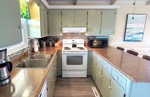 Holden Beach House | Canal home, 3 bedrooms, 2 bathrooms, dock, pet friendly, fenced in back yard.
