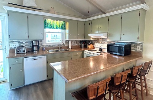 Holden Beach House | Canal home, 3 bedrooms, 2 bathrooms, dock, pet friendly, fenced in back yard.