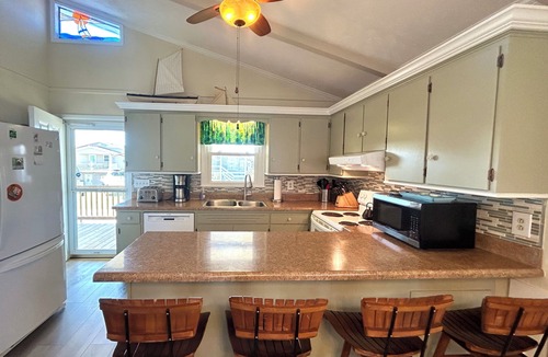 Holden Beach House | Canal home, 3 bedrooms, 2 bathrooms, dock, pet friendly, fenced in back yard.