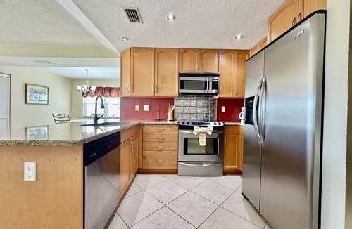 Capri Isle Condo | Canal-View Gem w/Pool in Treasure Island Paradise