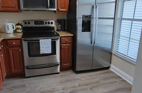 Capri Isle House | Charming 2 Bed Treasure Island Townhouse, heated community pool.