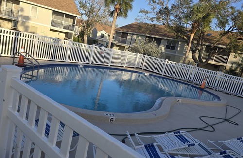 Capri Isle House | Charming 2 Bed Treasure Island Townhouse, heated community pool.