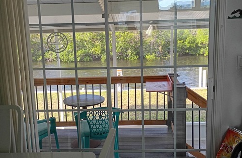 Port Charlotte House | Coastal, Waterfront Haven with boat dock