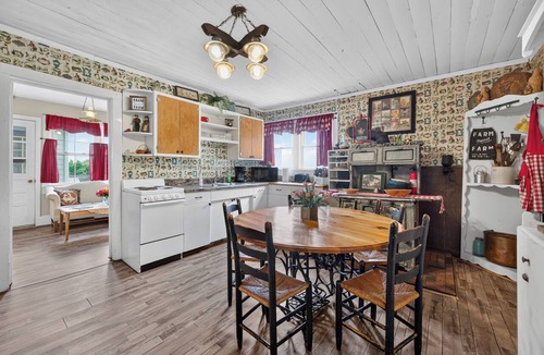 Galax House | Escape to this spacious countryside retreat featuring beautiful mountain views, a wraparound porch.
