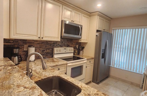 Casa del Mar Condo | Gorgeous Second Floor Waterfront Villa with Sunset views over Boca Ciega Bay!