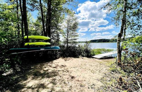 Stone Lake House | Group Lake Cabin with Ping Pong Table Loaded with Kayaks in Wisconsin