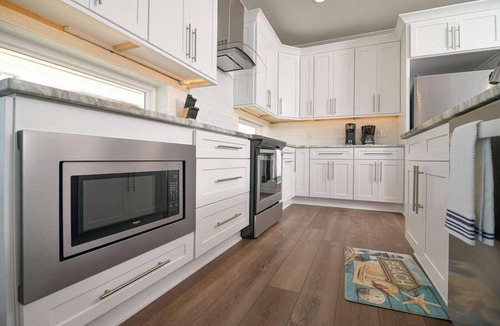 Holden Beach House | Hobbs Realty - Glad you're "Knot At Work" in this oceanfront home with a heatable pool and elevator