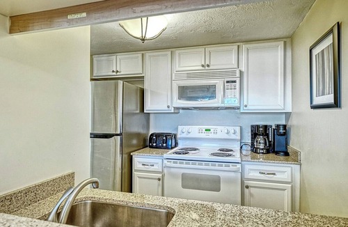 Longboat Key Apartment | LaPlaya 101E-Relax on your private lanai under the palms!