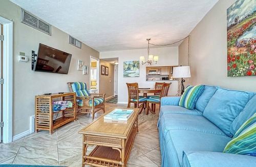 Longboat Key Apartment | LaPlaya 101E-Relax on your private lanai under the palms!