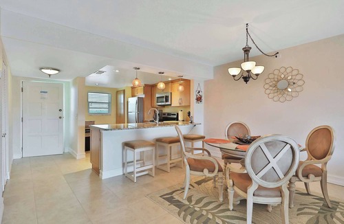 Indian Shores Condo | Light and airy condo with balcony pool hot tub and beach access
