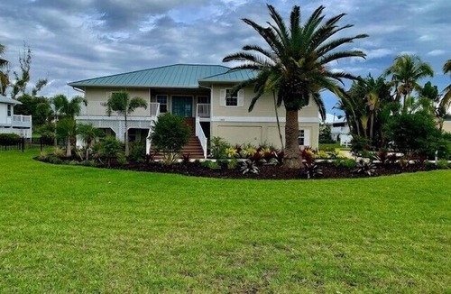 The Dunes House | Lovely pool home with golf course views in The Dunes community