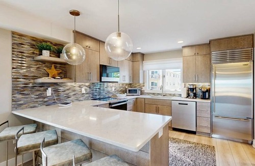 North Ocean City House | Luxurious oceanfront townhome with private deck and panoramic coastal views