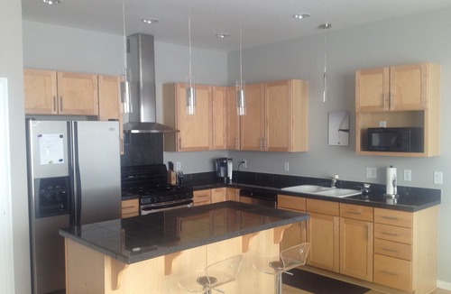 LoDo Condo | Luxury 2-Bed Riverfront Lodo. Great location, large Deck, 77" TV. On the Creek.