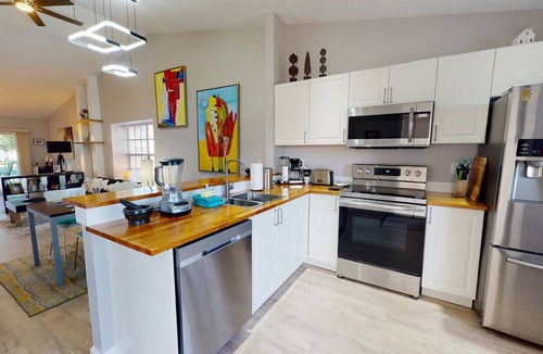 Capri Isle Condo | Modern Townhouse Easy Walking Distance to the Beach. Large Private Rec Room. Pool. Great Location.