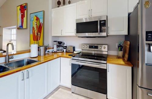 Capri Isle Condo | Modern Townhouse Easy Walking Distance to the Beach. Large Private Rec Room. Pool. Great Location.