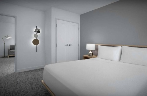Biggar Hotel | Near Gulf Coast Town Center | Pool, Free Breakfast + Kitchen