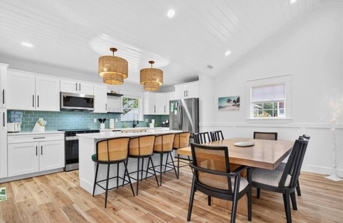 Tranquil Harbour House | Oak Island Lux Cottage | Fenced Yard & Heated Pool!