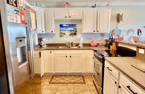 Tranquil Harbour Condo | OW 3201-Flirty Flamingo: Oceanview condo in Oak Island, sleeps 10, pet-friendly.