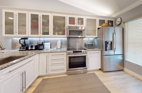 Capri Isle Condo | Quiet Community Just Minutes from Beach. Spacious. Heated Pool. Great Location.