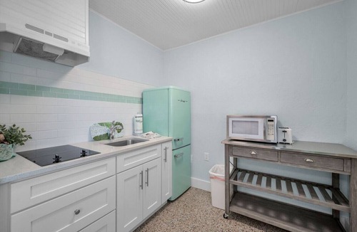 Sunset Beach Hotel | Room 10 · Renovated Boutique Hotel room with a Pool and dock