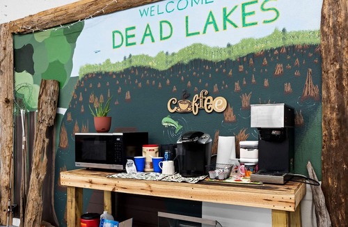 Wewahitchka Cabin | Rustic Lakefront Glamping Under the Stars with River Accesss & Kayaking in Wewahitchka, Florida