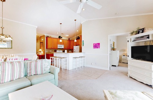 Sunset Beach Condo | SB61 Sunset Serenity: Sunny condo with a pool, balcony, kitchen, beach gear, W/D, & AC