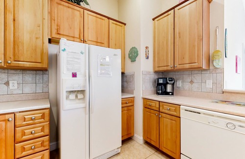 Sunset Beach Condo | SB61 Sunset Serenity: Sunny condo with a pool, balcony, kitchen, beach gear, W/D, & AC