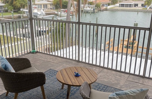 Capri Isle Apartment | "Stunning Waterfront Apartment on Treasure Island with Dock"