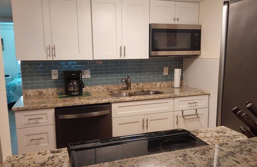 Sunset Beach Condo | Treasure Island Waterfront Condo, Equipped Fishing dock, Steps to Beach, Dining