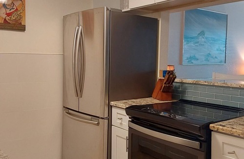 Sunset Beach Condo | Treasure Island Waterfront Condo, Equipped Fishing dock, Steps to Beach, Dining