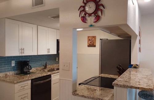 Sunset Beach Condo | Treasure Island Waterfront Condo, Equipped Fishing dock, Steps to Beach, Dining