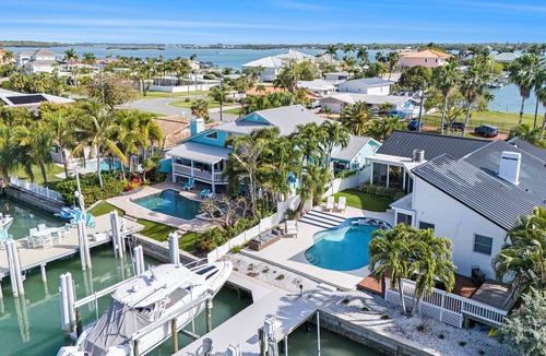 Capri Isle House | TREASURE ISLAND FLORIDA- Discover your luxury 4 bedroom home on canal fishing