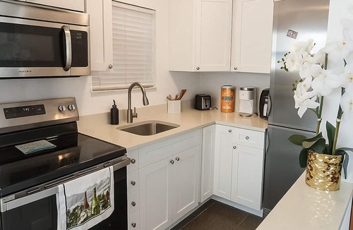 Capri Isle Condo | Treasure Island Sunset Spectacle: Waterfront Bliss, Beach Walks & Johns Pass Fun